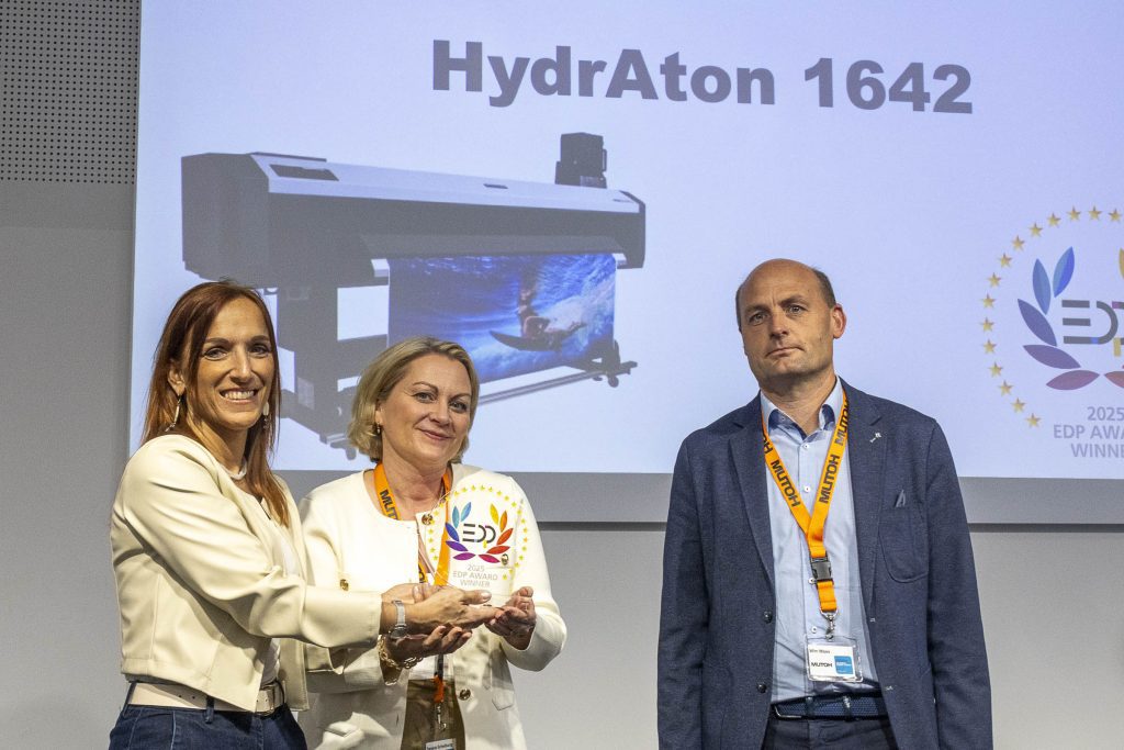 EDP award presentation for Mutoh Hydraton 1642 printer - two women hold glass trophy