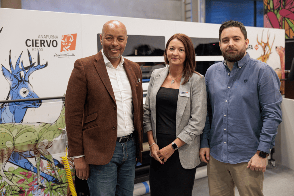 Team from Digital Plus standing in front of limited edition ciervo
