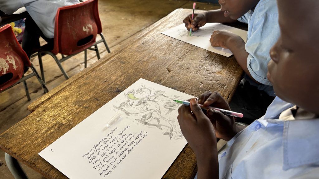 School child using writing materials donated by FESPA Foundation