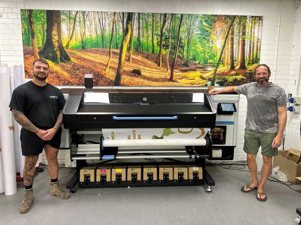 Sam Pratt (L), print manager, and Nathan Swinson-Bullough (R) of Imageco alongside their new HP Latex 830W printer.