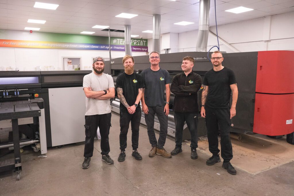 Simon Ward with the Greens the Signmakers Print Room team, employing young people