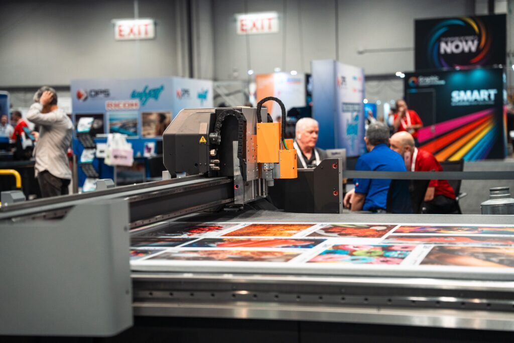 A Kongsberg digital cutting table in operation at a trade fair