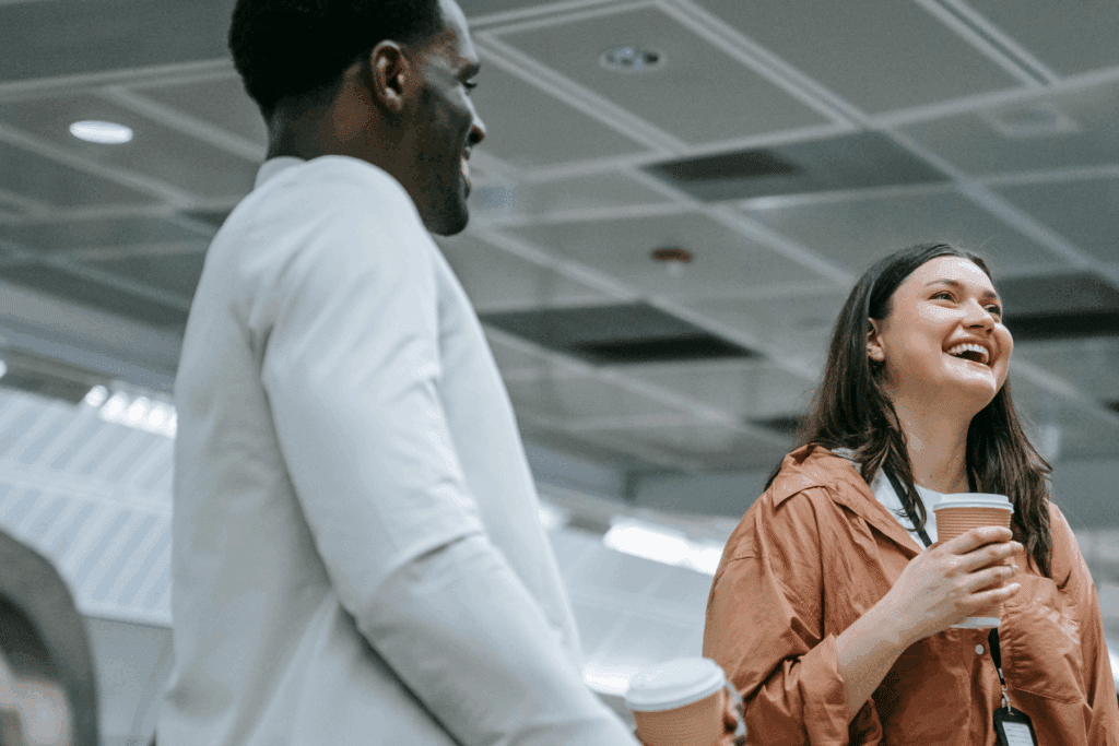Two people sharing a joke at work to represent how The Printing Charity provide support all year round, not just on Blue Monday
