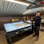 John Hulin, Director at Western Sign Systems, with BubbleFree Pro that has enabled the team to hit tight trade deadlines despite limited floor space.