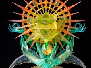 A complex, vibrant 3D printed sculpture by humanoise featuring geometric shapes and spiritual motifs, utilizing clear and coloured resins