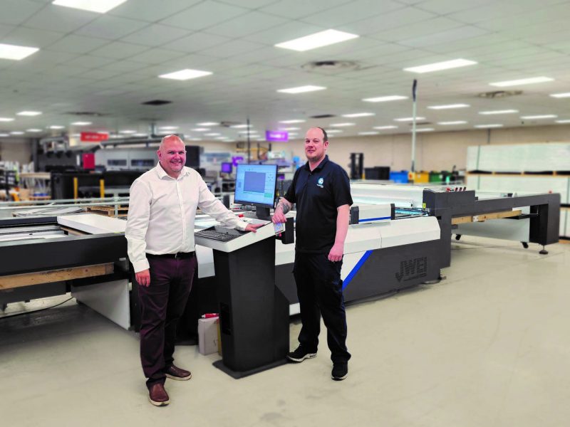 Left – Craig Walker (Finishing Manager), imageData Right – Stefan Agar (Mechanical Finishing Supervisor), imageData Both stood with the JWEI Automatic Packaging Feeder Stacker