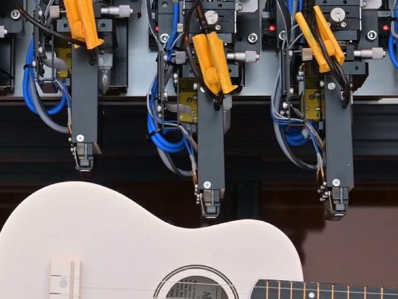 Epson's Direct to Shape Printing System printing on a guitar