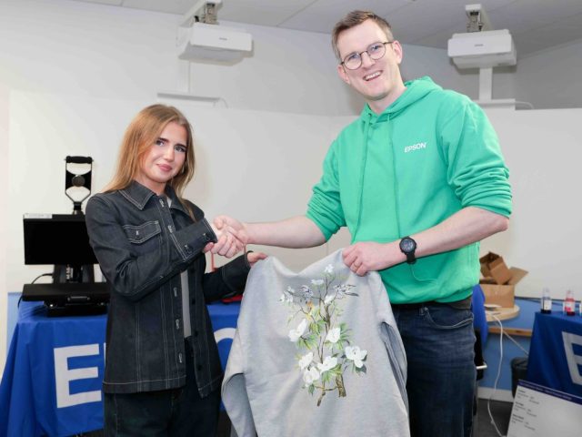 Kate Harvey won the best design competition, seen here with Epson Communication Manager, Charlie de la Haye