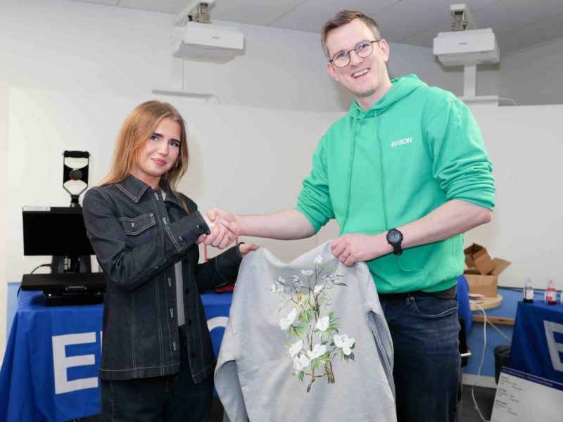 Kate Harvey won the best design competition, seen here with Epson Communication Manager, Charlie de la Haye