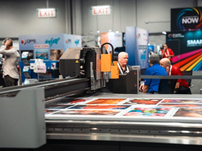 A Kongsberg digital cutting table in operation at a trade fair