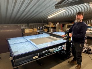 John Hulin, Director at Western Sign Systems, with BubbleFree Pro that has enabled the team to hit tight trade deadlines despite limited floor space.