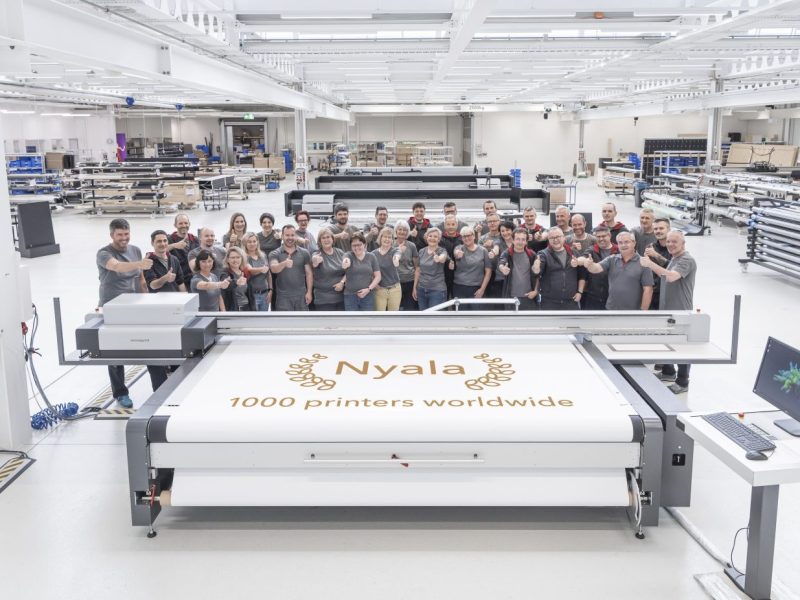 The swissQprint team celebrating their impressive milestone