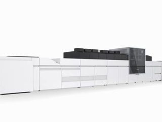 A large, industrial Canon varioPRESS iV7 B2 sheetfed production inkjet printer