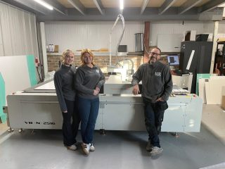 The KDR Projects team with the Vivid VeloBlade Nexus wide-format digital die cutter, purchased from Soyang Hardware
